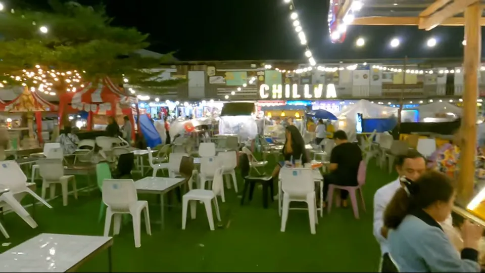 Halal seafood stall with customers under white tents at Chillva Market